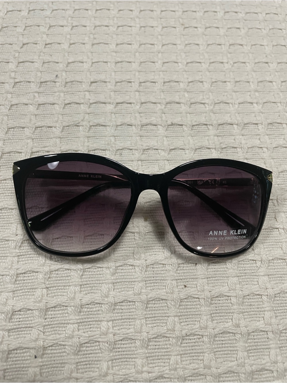 Anne Klein Black Frame Sunglasses with Purple Gradient Lenses